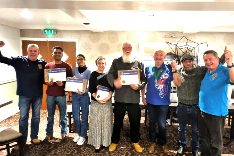 New members with their certificates