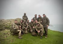 Service personnel hike to historic memorial for Remembrance Day