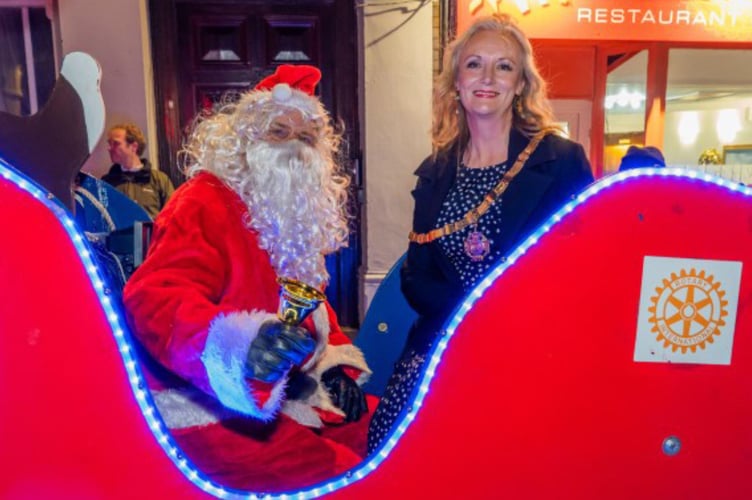 Father Christmas and Saltash town mayor, Cllr Rachel Bullock took to the streets in their sleigh. (Pictures: Mike Pitches Media)