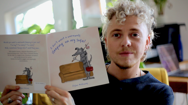 Dylan Holloway with his first children's book titled I Don’t Want A Werwolf Sleeping On My Sofa 