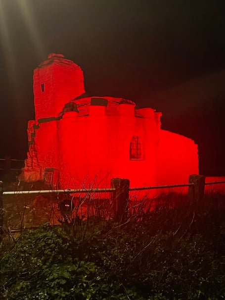 Huer's Hut illuminated red to mark World Aids Day (Picture: Andy Hannan)