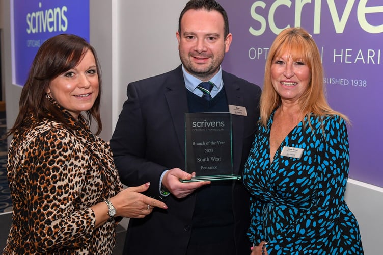 Scrivens Opticians & Hearing Care branch manager Mark Hounsell receives the Branch of the Year Award for Penzance from area manager Clair Davis and regional manager Linda Turner