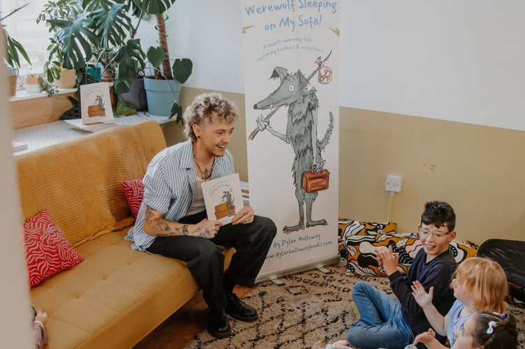Dylan Holloway reading to the children at the book launch  (Picture: Laura Hepburn)