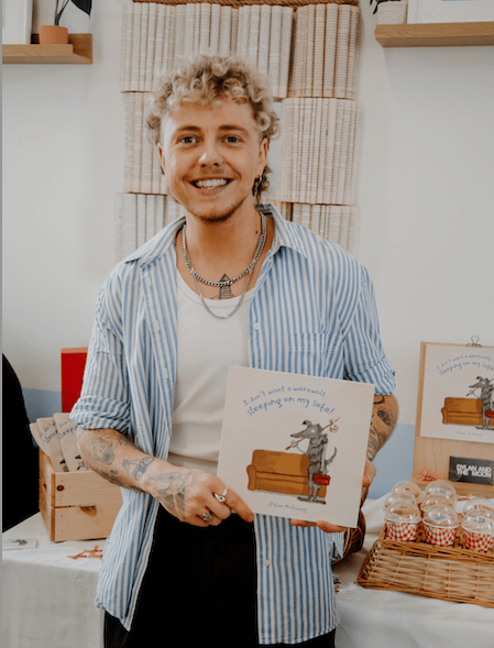 Dylan Holloway with his first children's book titled I Don’t Want A Werwolf Sleeping On My Sofa (Picture: Laura Hepburn)