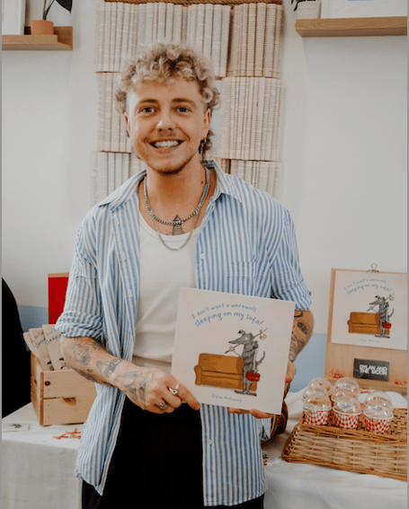 Dylan Holloway with his first children's book titled I Don’t Want A Werwolf Sleeping On My Sofa (Picture: Laura Hepburn)