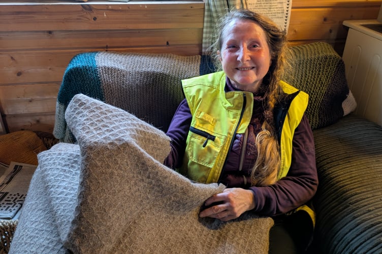 Mary with one of the blankets made out of alpaca and llama hair (Picture: Warren Wilkins)