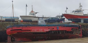 Council dismantles boat that sank in harbour