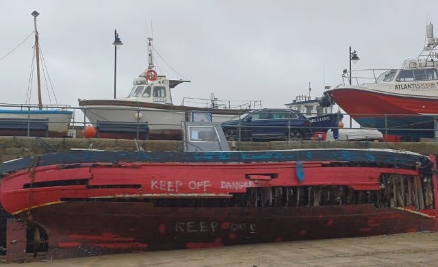 Council dismantles boat that sank in harbour