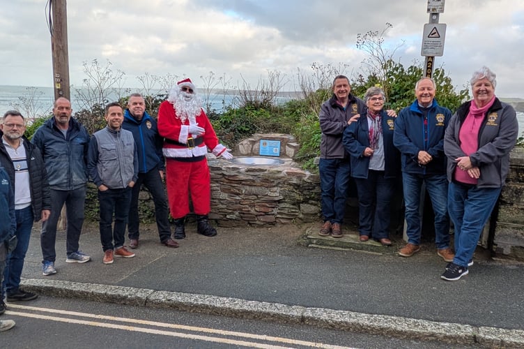 Father Christmas unveils the new wishing well (Picture: Warren Wilkins)