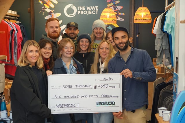 Business delivers £7,650 Christmas gift to surf therapy charity