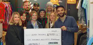 Business delivers £7,650 Christmas gift to surf therapy charity