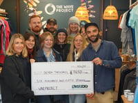 Business delivers £7,650 Christmas gift to surf therapy charity