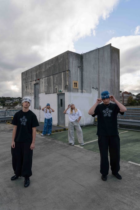 Finley Taylor (left) modelling some of his clothing range with friends