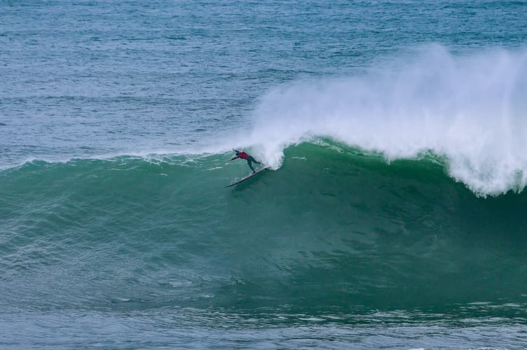 Rob Fowlie manages to negotiate the thick lip on a giant Cribbar wave (Pictures: Geoff Tydeman)