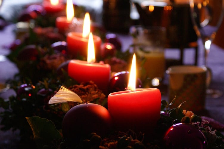 A candle left burning almost cost a Saltash woman her home just days before Christmas