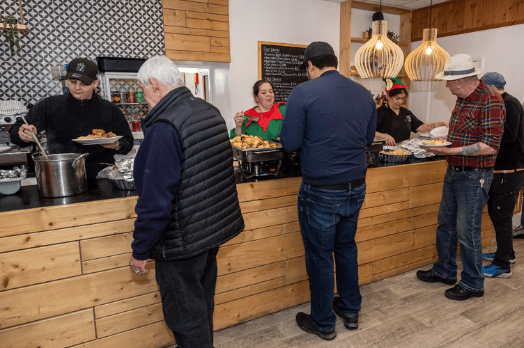 Harbour Housing staff and volunteers serving a delicious Christmas meal to residents.