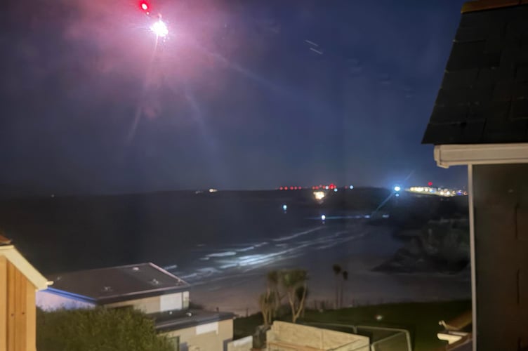 The Coastguard helicopter used a search light to scour the bay (Picture: Greg Circ)