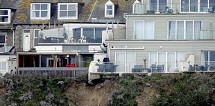 Apartment complex left in precarious position following rockfall