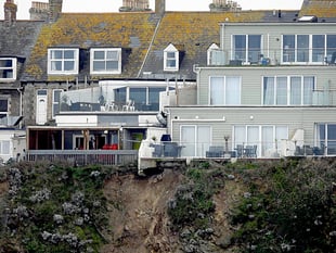 Apartment complex left in precarious position following rockfall