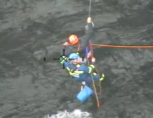 Coastguards made a split decision to lift the stricken walker from rocks via rope rescue (Picture: HM Coastguard) 