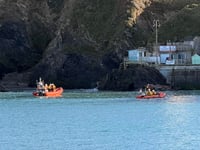 Emergency services scrambled after person was cut off by the tide