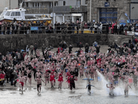 Swimmers take part in traditional New Year’s Day dip for charity