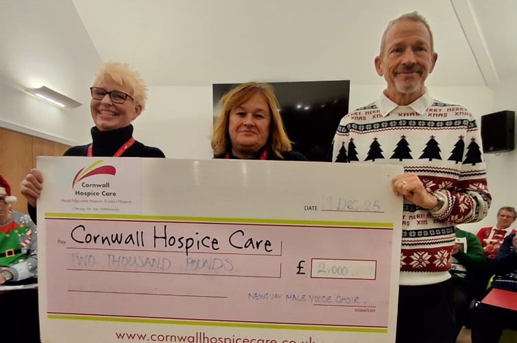 Choir chairman Andy Peters handed over the cheque to the Cornish Hospice Care
