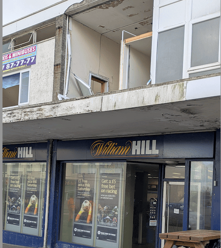 The front fascia has been ripped out from a vacant office above William Hill (Picture: Warren Wilkins)