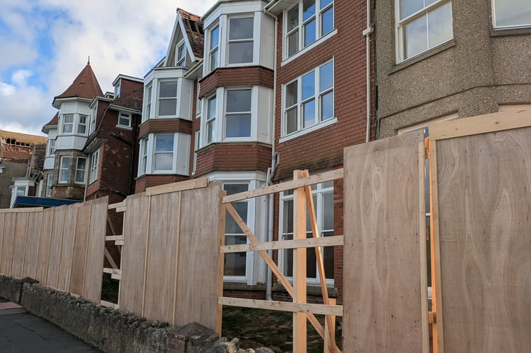 Hoardings and tiles have been torn from the derelict Hotel Bristol by the high winds (Picture: Warren Wilkins)
