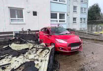 Part of roof blown off St Austell tower block lands on cars