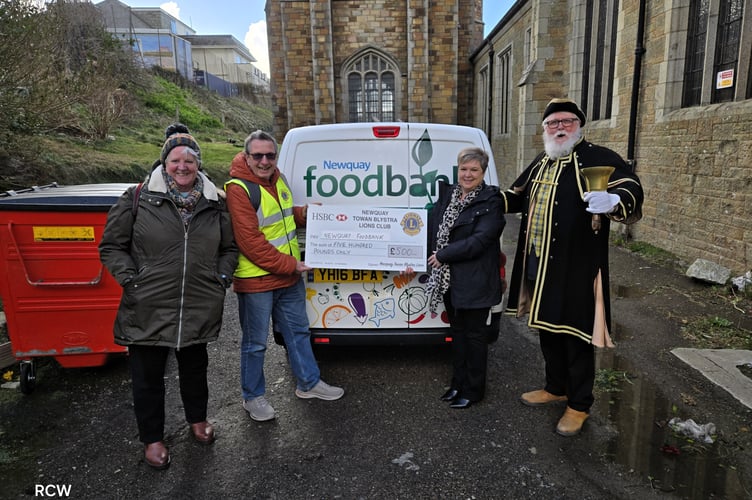 Newquay Towan Blystra Lions Club making the donation to the Pot Noodle Ministries