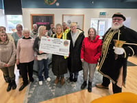 Charity serves up £1,000 donation to help tackle food poverty