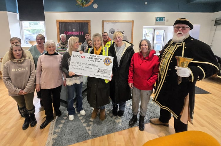 Newquay Towan Blystra Lions Club making the donation to the Pot Noodle Ministries