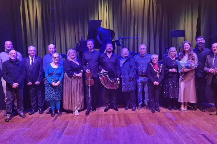 The Kyiv Tango Orchestra pictured alongside members and officers from Liskeard Town Council