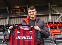 Tinners sign striker Stretton to aid survival bid