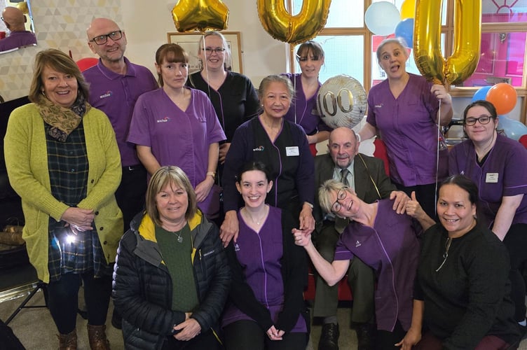 Staff and colleagues at St Anne's Care Home in Saltash celebrate the 100th birthday of Cyril Martin