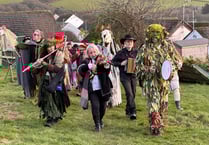 Traditional wassail takes place in orchard looking over coast