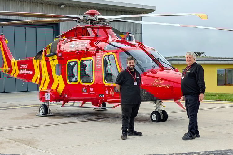 (L-R) Lappa Valley’s Ben Harding and Keith Southwell pose for a photo with Cornwall Air Ambulances newest helicopter Duke of Cornwall