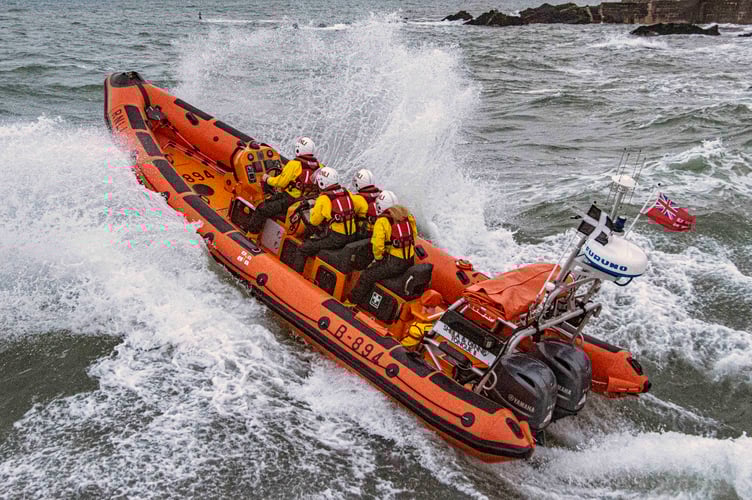Looe RNLI Atlantic 85 Sheila and Dennis Tongue II leaving Looe negotiating heavy seas