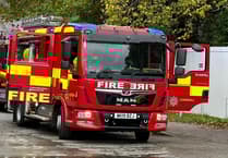 Fire crews tackle car blaze on busy St Austell road
