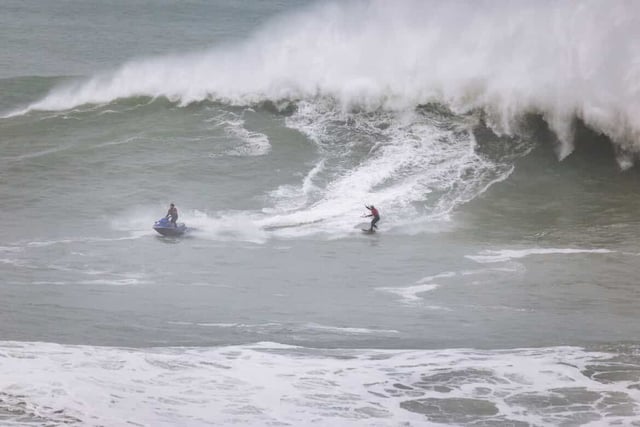 Brave surfer tackles biggest waves ever ridden in the UK  