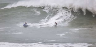 Brave surfer tackles biggest waves ever ridden in the UK  