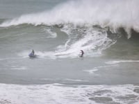 Brave surfer tackles biggest waves ever ridden in the UK  