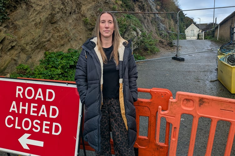 Emma Goldy in front of the barriers following the latest cliff collapse (Picture: Warren Wilkins)