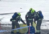 Blue plastic drum washed up on beach at Par sparks emergency services response