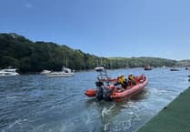 Lifeboat assists occupants of stranded vessel