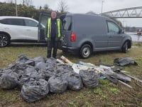 Councillor steps up to clear littered roundabout