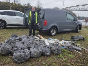 Councillor steps up to clear littered roundabout