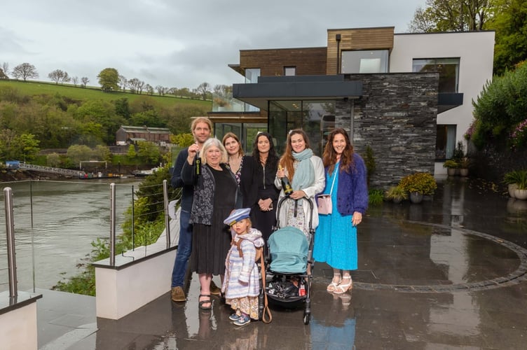 June Smith and her family outside her Omaze property overlooking the Fowey Estuary in 2023