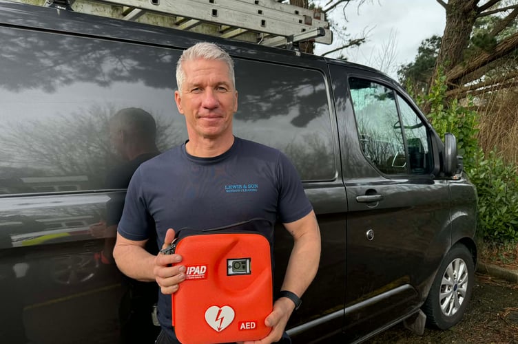Treffry Road resident Ryan Lewis with his defibrillator